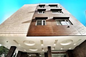 a tall building with windows on the side of it at Airport Hotel Delhi Aerocity, Near Yashobhoomi in New Delhi
