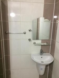 a bathroom with a sink and a mirror at Paradıse lost otel in Degirmen