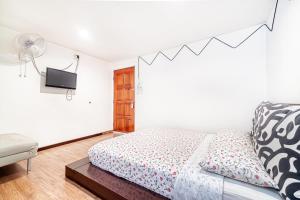 Postel nebo postele na pokoji v ubytování Snooze Hotel