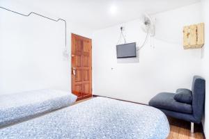 Postel nebo postele na pokoji v ubytování Snooze Hotel