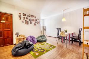 a living room with a table and a dining room at Snooze Hotel in Brinchang