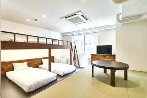 Voodi või voodid majutusasutuse Cocts Akihabara toas