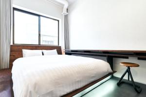 Voodi või voodid majutusasutuse Cocts Akihabara toas