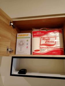 a shelf with three boxes on top of it at Avida Tower 3 Unit 606 in Iloilo City