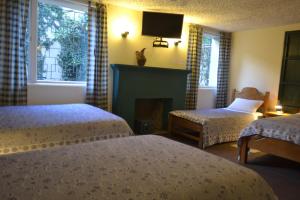 Letto o letti in una camera di Travellers Inn