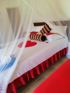 a bedroom with a bed with a canopy at Super View in Ella