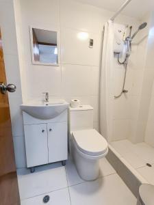 a bathroom with a toilet and a sink and a shower at SANTA VICTORIA HOUSE in Chiclayo