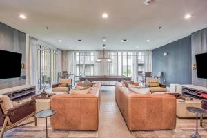 a large living room with two couches and a television at Ft Worth 1BR Luxury Retreat in Fort Worth