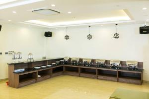 a room with a counter with aasteryasteryasteryasteryasteryasteryasteryasteryastery at Royal Hotel Sầm Sơn in Sầm Sơn