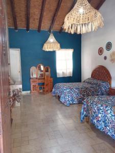 Postel nebo postele na pokoji v ubytování Hotel Cabañas Chalamu