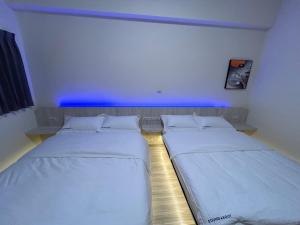Krevet ili kreveti u jedinici u okviru objekta Penghu Roundabout Guesthouse