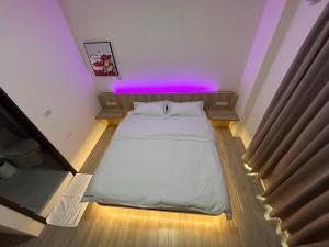 Krevet ili kreveti u jedinici u okviru objekta Penghu Roundabout Guesthouse