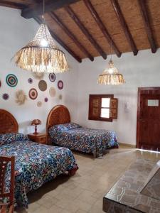 Postel nebo postele na pokoji v ubytování Hotel Cabañas Chalamu