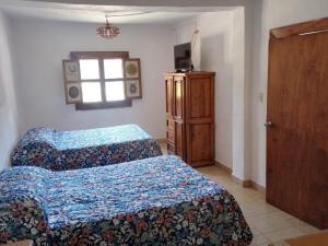 Postel nebo postele na pokoji v ubytování Hotel Cabañas Chalamu