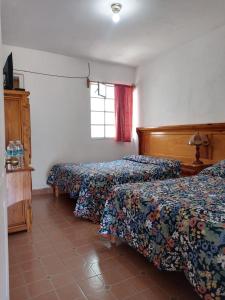 Postel nebo postele na pokoji v ubytování Hotel Cabañas Chalamu