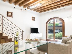 TV a/nebo společenská místnost v ubytování Residence Le Bugne