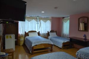 Letto o letti in una camera di Travellers Inn