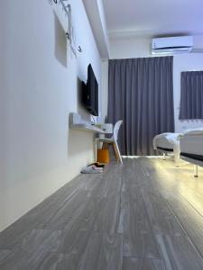 TV a/nebo společenská místnost v ubytování Penghu Roundabout Guesthouse