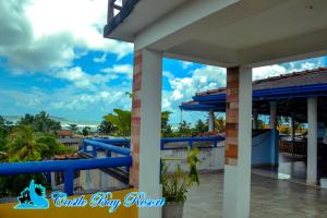 a view of the ocean from the balcony of a resort at Castle Bay Resort in Weligama