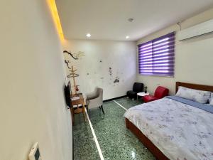 Letto o letti in una camera di Xingang Homestay