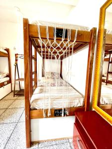 Postel nebo postele na pokoji v ubytování Pequi hostel