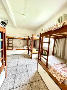 Postel nebo postele na pokoji v ubytování Pequi hostel