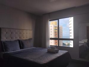 Ένα ή περισσότερα κρεβάτια σε δωμάτιο στο ILUSION FLAT-Ponta Negra +39 φωτογραφίες