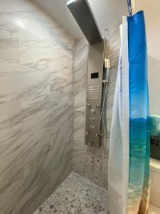 a bathroom with a shower with a glass door at Mazor Luxury Three Bedrooms Vacation Home in Fort Lauderdale