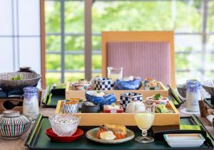 a table with a tray of food and drinks at Kashoen in Hanamaki