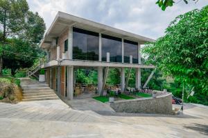 a house with large windows on the side of it at Hillcrest Dawn, Bentong in Bentong