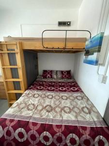 a bed in a small room with a bunk bed at Apartamento zona 1 in Guatemala