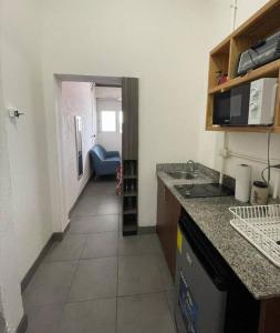 a kitchen with a sink and a counter top at Apartamento zona 1 in Guatemala