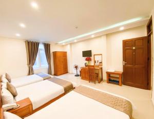 Postel nebo postele na pokoji v ubytování Hotel Phạm Duy