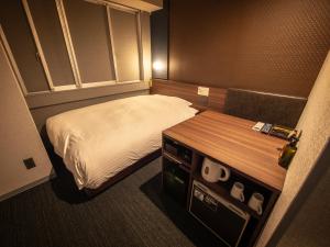 Postel nebo postele na pokoji v ubytování Super Hotel Premier JR Nara Eki