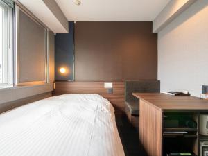 Postel nebo postele na pokoji v ubytování Super Hotel Premier JR Nara Eki
