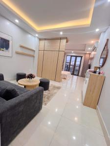 a living room with a couch and a table at Ez mart and stay in Hai Phong