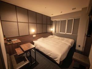 Postel nebo postele na pokoji v ubytování Super Hotel Premier JR Nara Eki