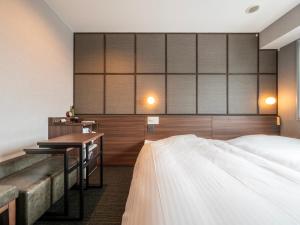 Postel nebo postele na pokoji v ubytování Super Hotel Premier JR Nara Eki
