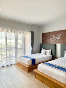 Postel nebo postele na pokoji v ubytování Air Diamond Hotel