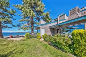 a house with a view of the ocean at Lakeland Village 620 - Beachfront Bliss in South Lake Tahoe