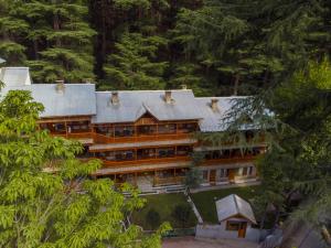 an aerial view of a large building with trees at Hotel Negi's Mayflower A heritage Since 1965 in Manāli