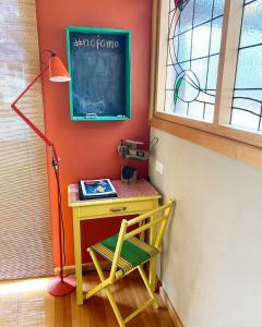 a classroom with a desk with a chair and a chalkboard at NOFOMO AT ADVENTURE BAY in Adventure Bay