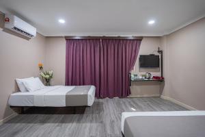 Postel nebo postele na pokoji v ubytování HOTEL 28 RAPID