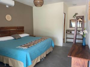 Postel nebo postele na pokoji v ubytování Gecko Hotel
