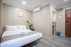 Postel nebo postele na pokoji v ubytování HOTEL 28 RAPID