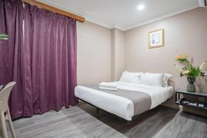 Postel nebo postele na pokoji v ubytování HOTEL 28 RAPID