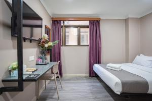 Postel nebo postele na pokoji v ubytování HOTEL 28 RAPID