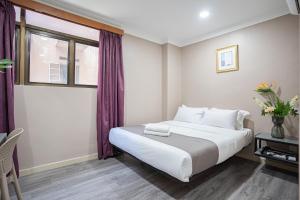 Postel nebo postele na pokoji v ubytování HOTEL 28 RAPID