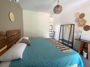 Postel nebo postele na pokoji v ubytování Gecko Hotel