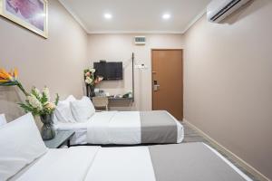 Postel nebo postele na pokoji v ubytování HOTEL 28 RAPID